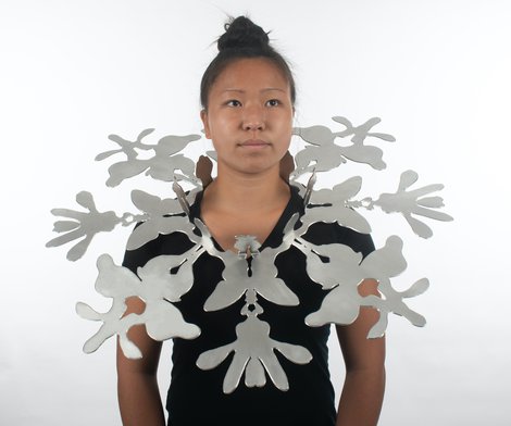 necklace of butterfly shapes surrounding neck