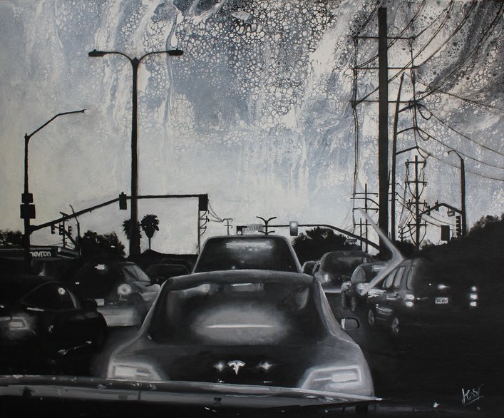 Cars in traffic with street lights and phone poles