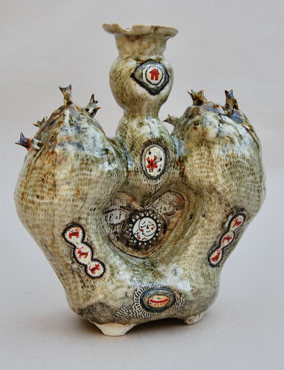 Ceramic sculpture with textured snake skin surface