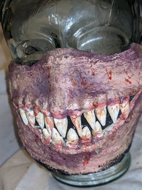 Face mask made of skin toned latex with prosthetic